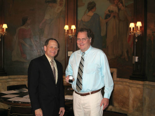 Ted Elfrink receives his 40-year service pin from Mayor Francis G. Slay on April 19, 2013