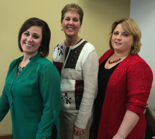Alexa, Robin and Valerie wear their holiday attire for Wear Your Christmas Sweater Day