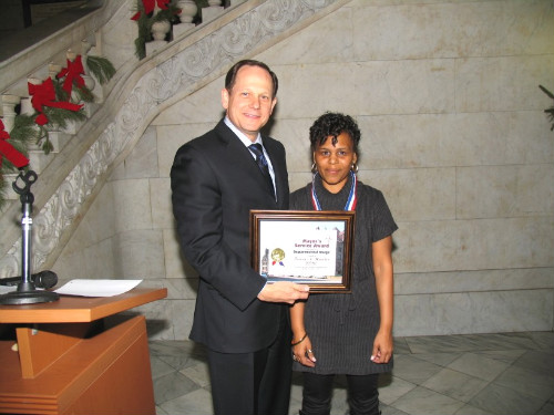 Mayor Francis G. Slay presents a Mayor's Service Award to Teresa Hunter.