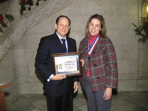 Mayor Francis G. Slay presents a Mayor's Service Award to Christine Boyer, Office on the Disabled.